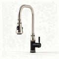 Brushed nickel pull-down kitchen faucet with black base and swivel spout